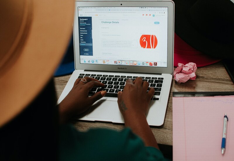 freelancing websites | Image: girl working on a laptop | logic worker